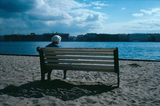 Petersburg one legged woman overlooking river Neva