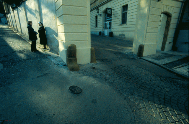 women talking Prague street