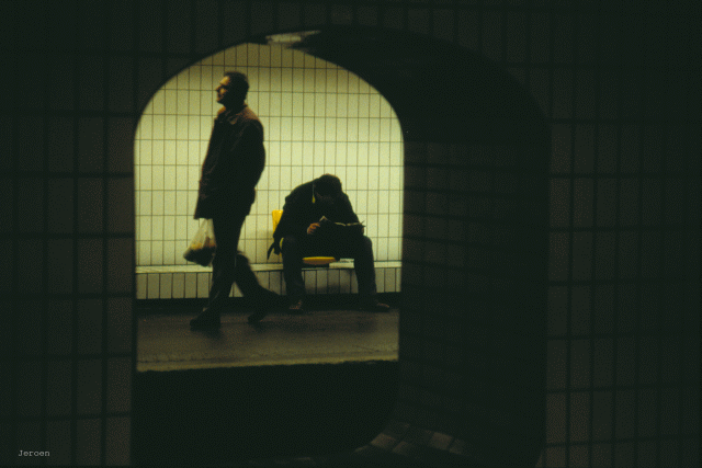 men waiting for Paris metro